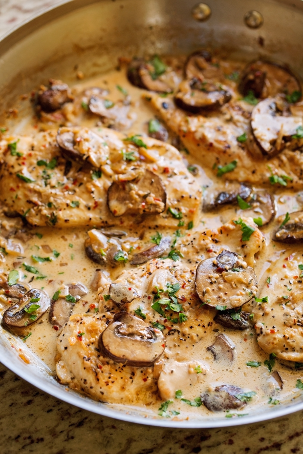 Another one skillet chicken recipe! This easy chicken dinner is made with sautéed garlic and mushrooms and topped with a creamy sauce. I used chicken breasts for this recipe, but chicken thighs would be delicious too!