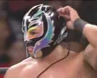 wwe rey mysterio removes mask wcw