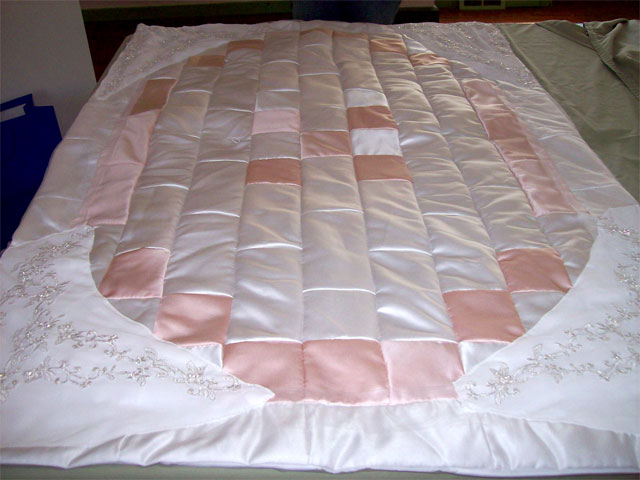 quilt made from wedding dress Can't quite give up those cute baby clothes