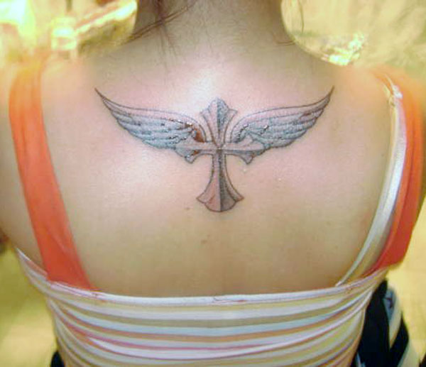 Really nice cross tattoos design with angel wings on the back neck makes a girl look pretty