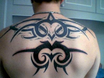 Excellent Tribal Tattoo On Upper Back For Male