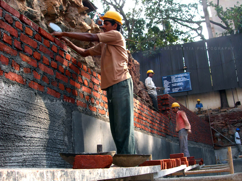 construction workers laying bricks at site in mumbai by kunal bhatia photo blog