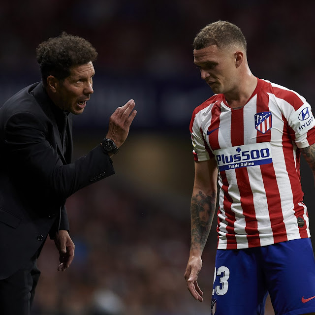 Atletico Madrid manager Diego Simeone talking to defender Kieran Trippier during a La Liga match