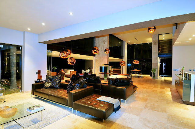 Picture of black modern furniture in the living room as seen at night