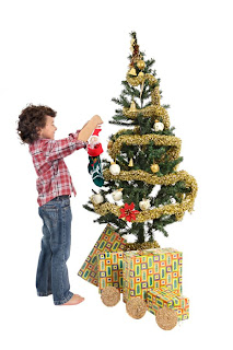 Small boy decorating the Christmas tree religious Christian picture