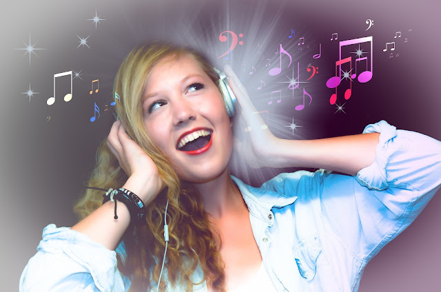 Image of a singer who is singing song with headphones