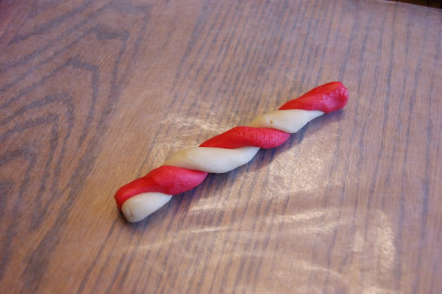 Making Candy Cane Cookies ~ two colors of almond sugar cookie dough twisted together! A fun & festive Christmas treat.  www.thekitchenismyplayground.com