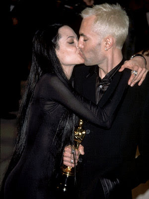 angelina jolie brother kiss. Angelina Jolie showed off her figure in a black