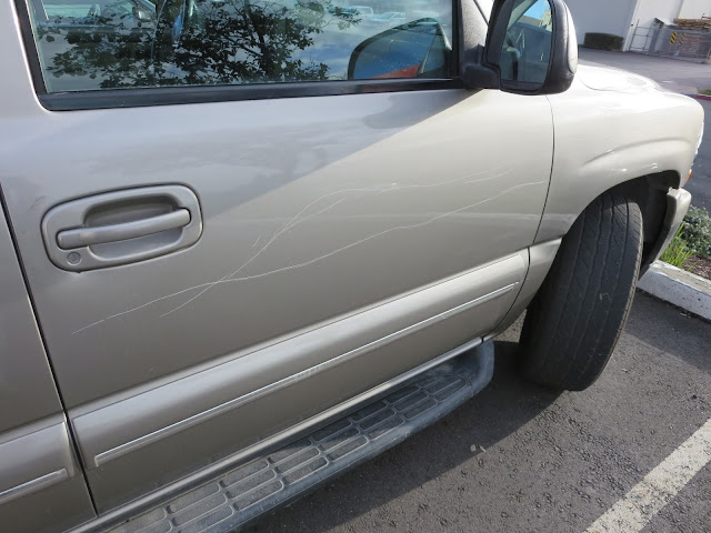 Vandalism on Chevy Tahoe before repairs & paint at Almost Everything Auto Body