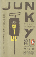 A cover for the 50th anniversary edition of "Junky," featuring a cartoon of a syringe with a face in it.