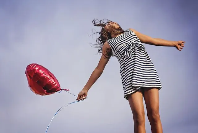 Girl jumping up in happiness