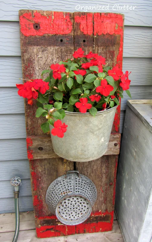 Wagon Board Backdrop for Galvanized Pail Planter www.organizedclutterqueen.blogspot.com