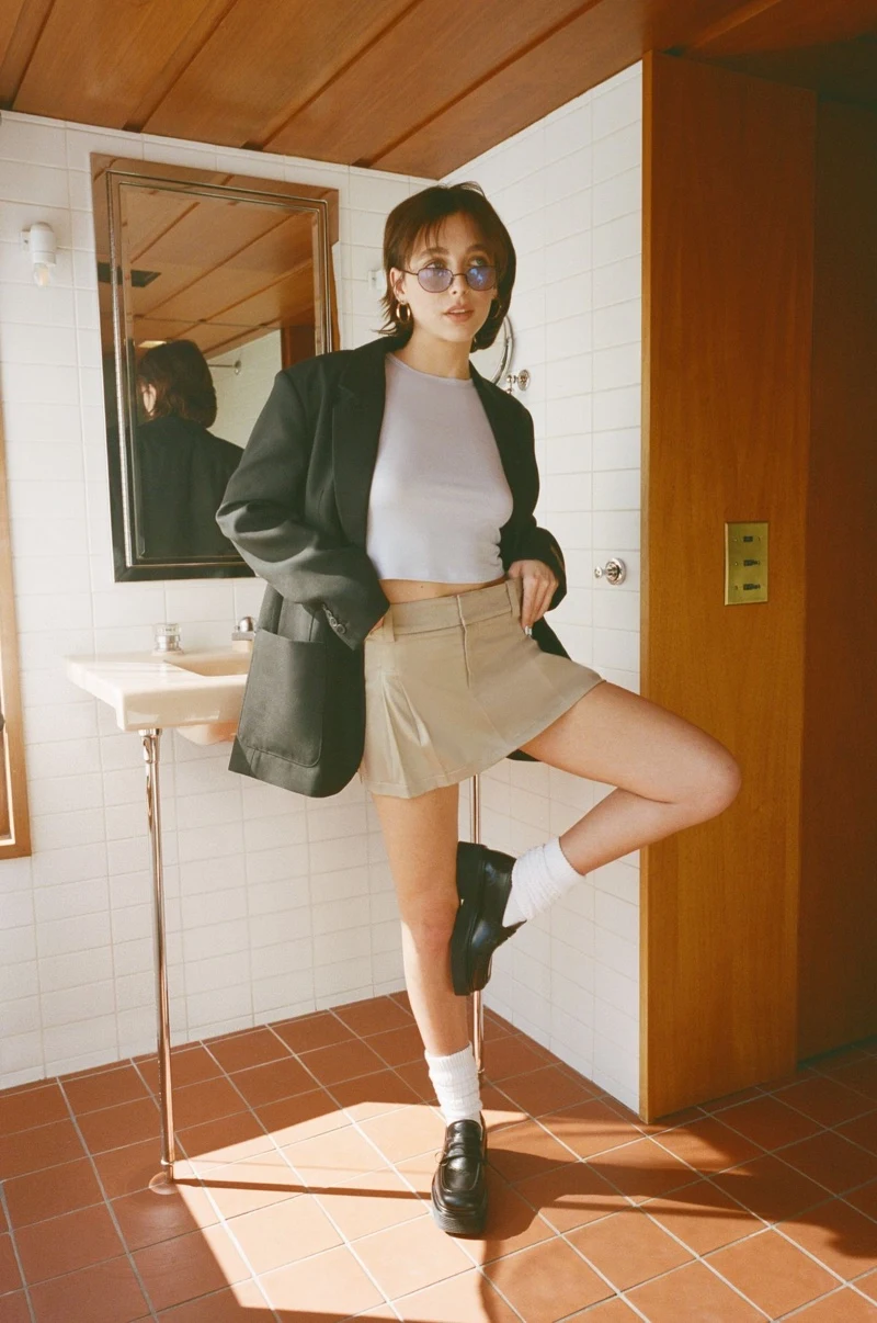 Emma Chamberlain looks effortlessly cool in a 90s look for the Aritzia spring 2023 campaign