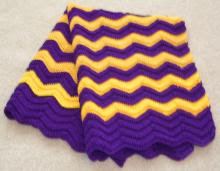 finished purple and gold afghan