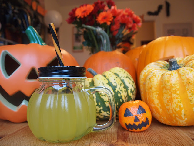 Glass pumpkin drinking jars with black and orange stripe straw from Party Pieces