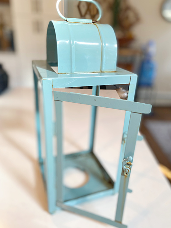 blue rusty lantern with glass removed