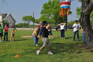 Darrell in the last stage of his swing, the pinata is about 4 feet above his head