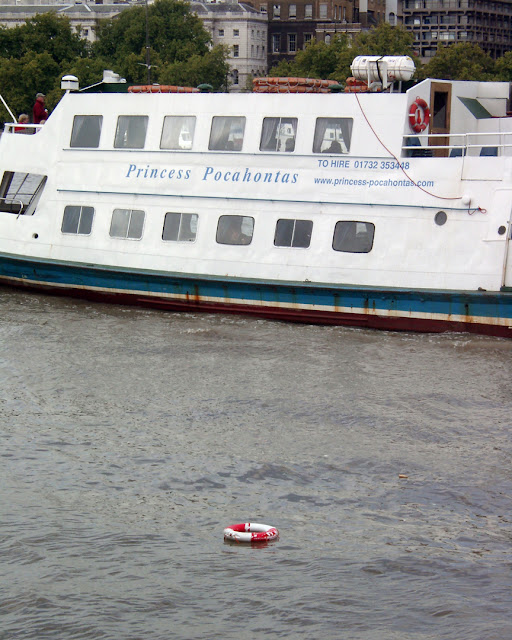 Lifebuoy in the water near Princess Pocahontas, River Thames, 
London