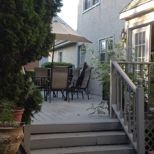 table and chairs on a gray deck