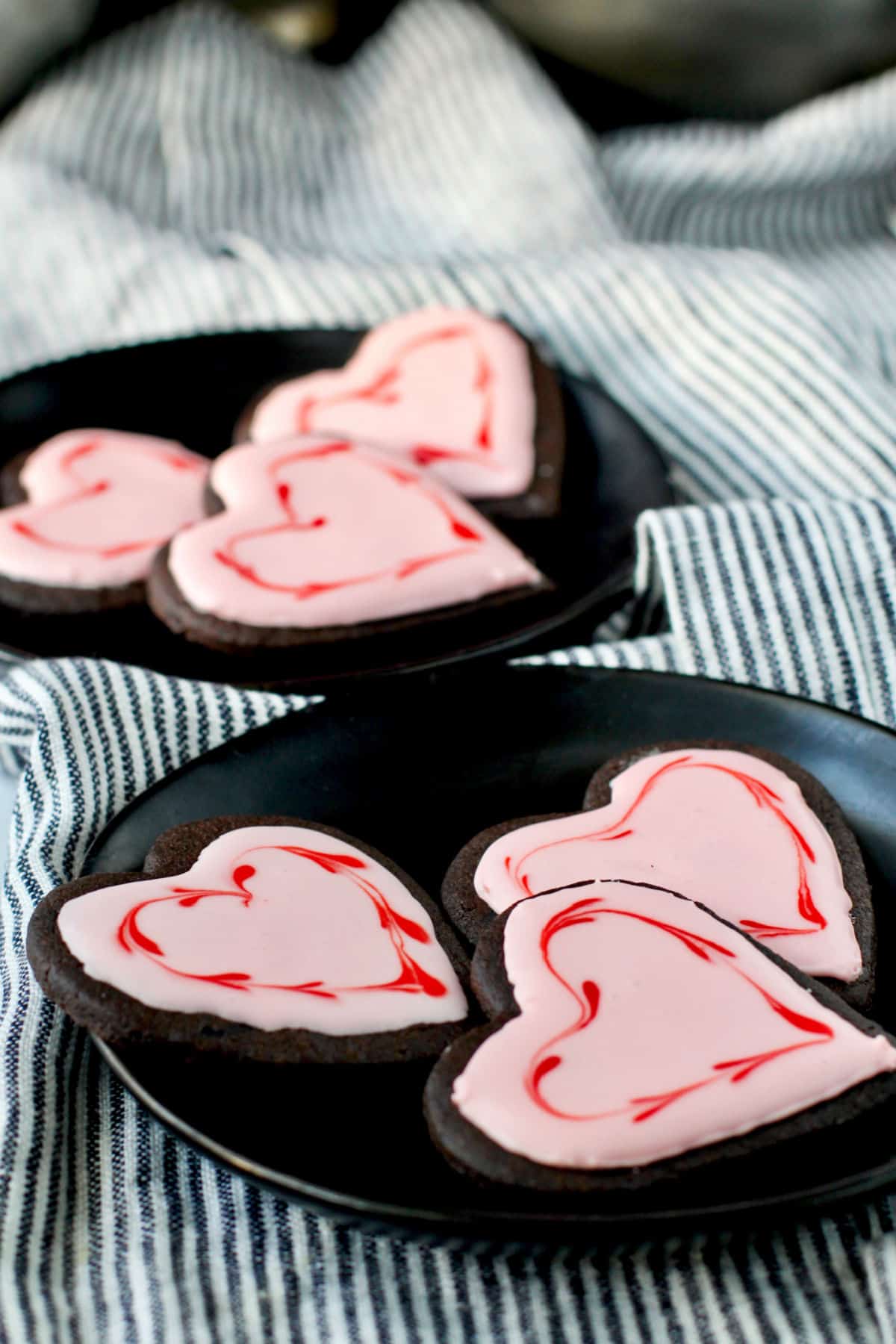 Chocolate Valentine Sugar Cookies on Plates.