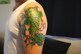 Green Koi Fish Tattoo on Arms
