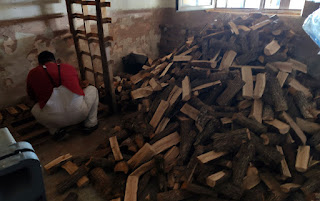 Halil stacking the firewood