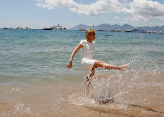 Jennifer Katharine Gates playing with water on beach