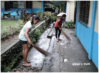 Parents helping in cleaning up