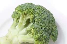 health benefits of broccoli. Fresh green broccoli on light background