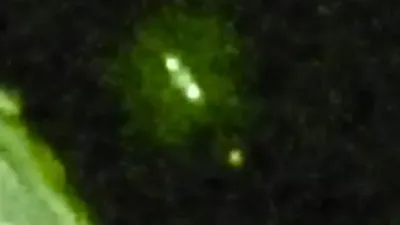 Large cylinder shape UFO releases Orbs over the Moon.