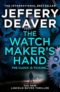 Book "The Watchmaker's Hand" by Jeffery Deaver. Against a murky background of blues and greys, a dark figure stands. Surrounding them are cogwheels and other watch internal parts in an arc.