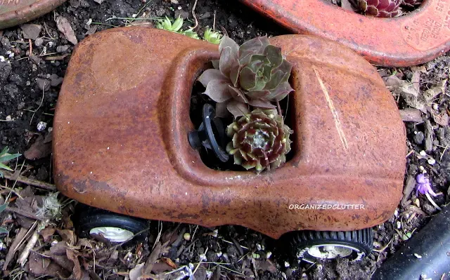 Photo of rusty race car planter.