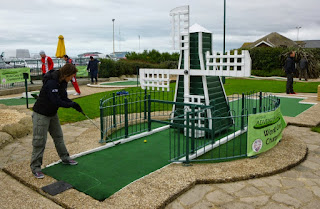 Emily playing the windmill hole at Hastings Crazy Golf