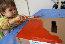 Child painting a box