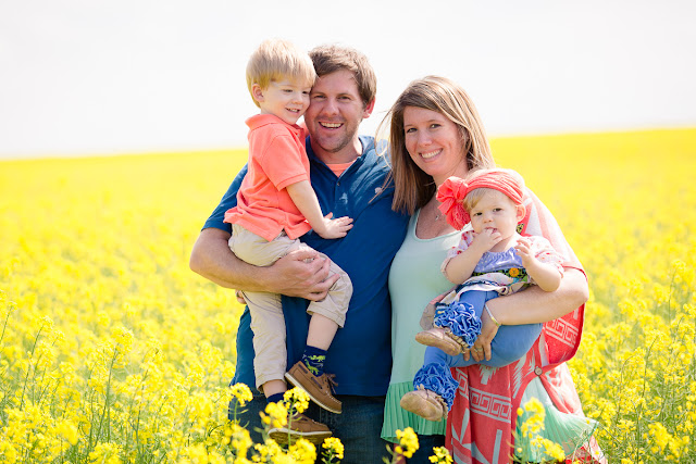 Family session including one-year cake smash in an Oklahoma canola field by Michelle Valantine Photography.