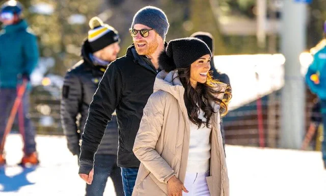 Meghan Markle wore a Barley maxi puffer jacket by Calvin Klein. Sorel Joan arctic boots. Co cashmere crew neck sweater