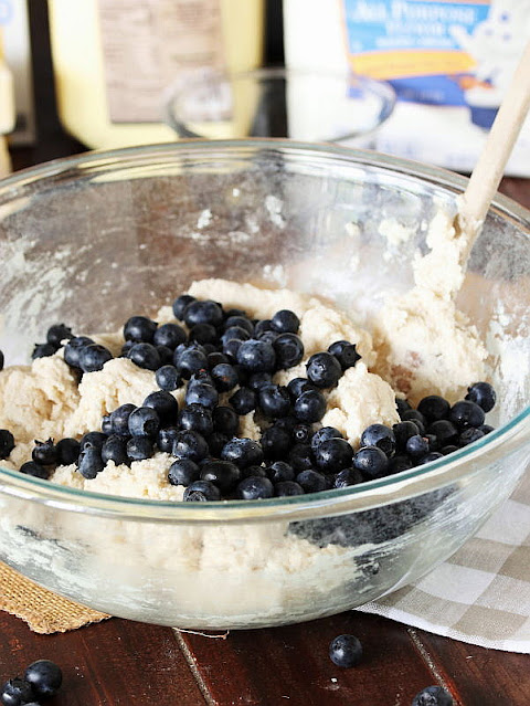 Adding Fresh Blueberries to Biscuit Dough Image