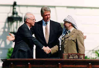 Yitzhak Rabin and Yasser Arafat at the signing ceremony of the Oslo Accords