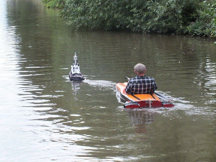 Just When You Thought You'd Seen Everything: Man Uses Tiny Tugboat to Cruise River