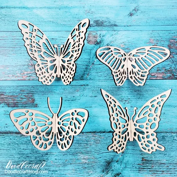 I really should make all ten of the butterfly designs because they are all different and unique.   I picked my 4 most favorite for this craft, since there's only 4 of us in our home right now...and they all fit on one piece of 12x12 basswood with a little piece to spare for another project.