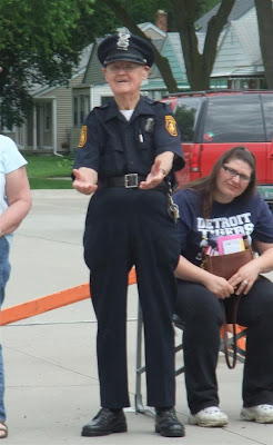 police man likes candy, old cop, parade