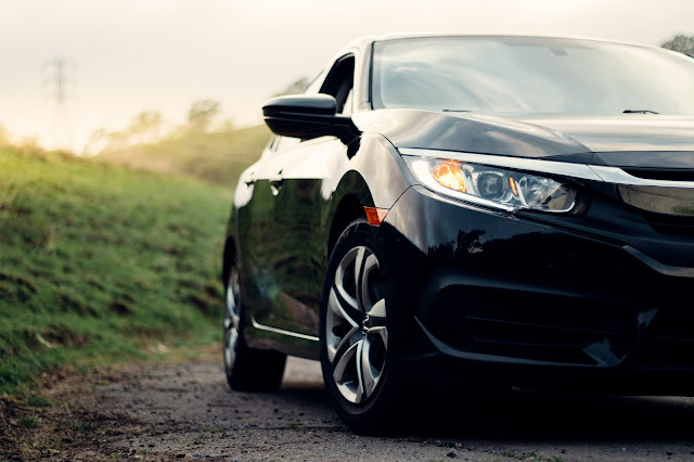 Car on grass:Photo by Griffin Wooldridge on Unsplash