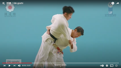 Picture of Judoka looking in the direction (away from Uke and down) whilst perfoming Uki Goshi