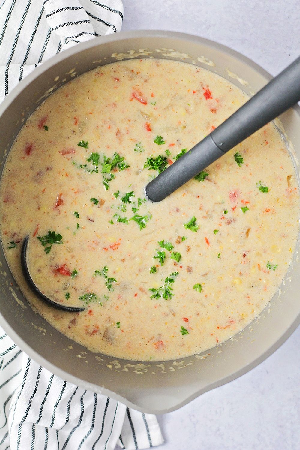 This Instant Pot summer corn chowder is a great way to enjoy a tasty soup without heating up the whole house! It's simple to make and so delicious!