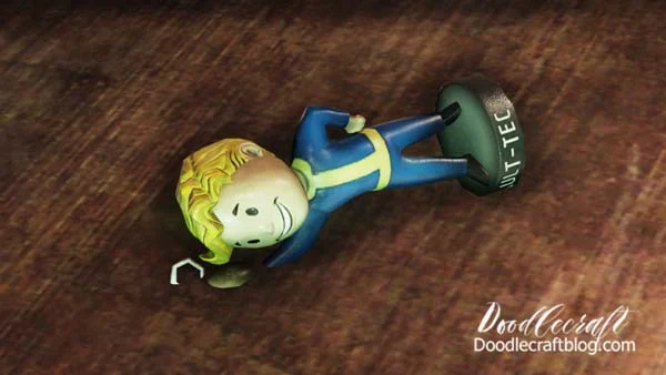 Fallout 76 Bobblehead perk in the wasteland laying on its side.