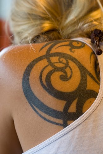 tribal tattoos for women on arm