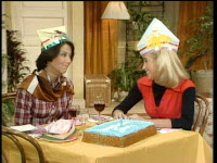 Janet and Chrissy wear party hats