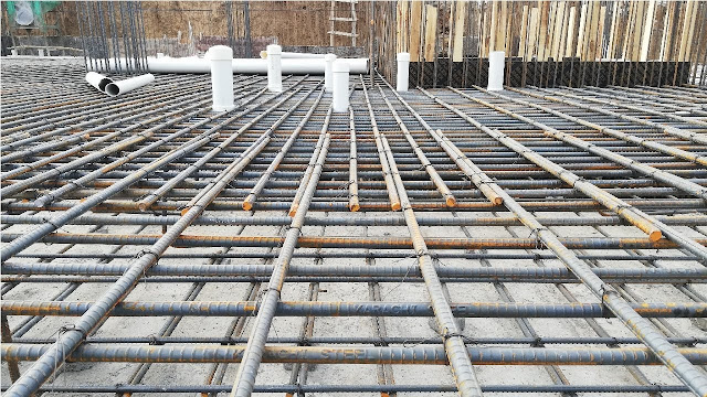 Steel bars lapping with extra bars in raft foundation