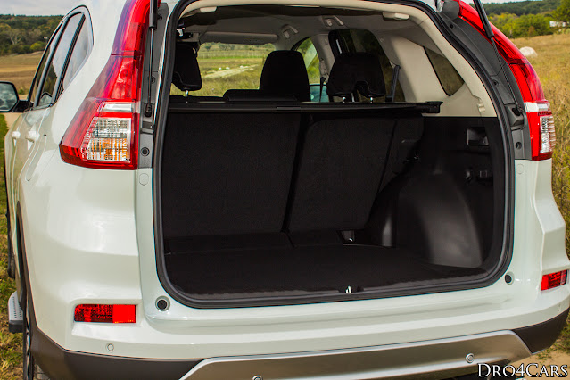 The 2015 Honda CR-V has a lever to fall down the backrest of the back seats inside the trunk.