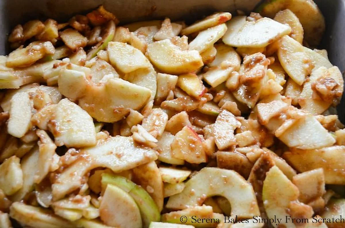 Best Apple Crisp filling spread in the bottom of a stainless steel bowl.